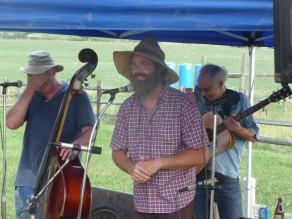 The man of the farm, cracking up the blue grass band behind him. (Blooming Glen Farm)